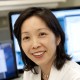 Dr. Heidi Kong in front of computer screens