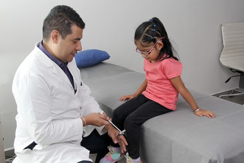 A doctor examines a patient
