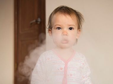 Photo of a child surrounded by smoke