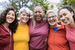 Photo of multicultural women group of women smiling.