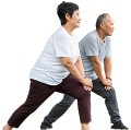 Man and woman stretching knee