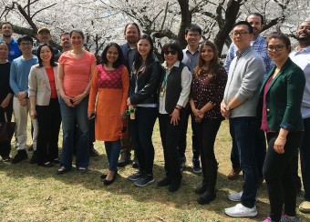 Staff of Heidi Kong's Lab unde cherry blossom trees (2020)