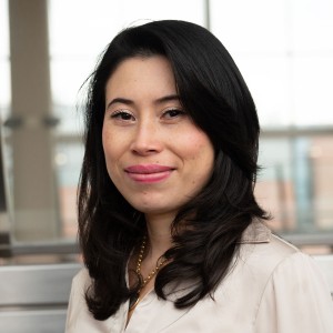 Headshot of a woman with long dark hair.