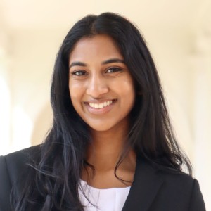 eadshot of a young woman with long dark hair.