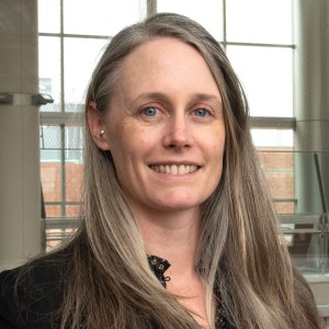 Headshot of a woman with long hair.