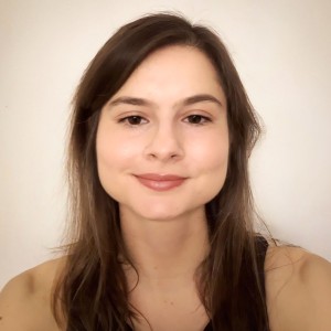 Headshot of a young woman with long dark hair.