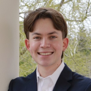 Headshot of a young man with short hair.