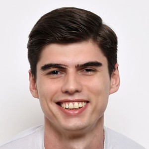 Headshot of a man in professional attire
