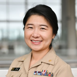 Headshot of a woman with short hard in military uniform