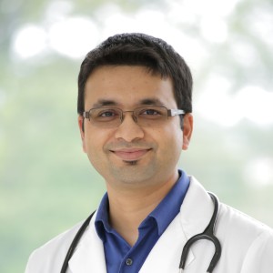 Headshot of a man wearing a labcoat.