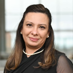Headshot of a woman with long dark hair.