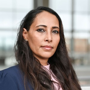 Headshot of a woman with long dark hair.