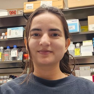 Headshot of a young woman in a lab.