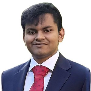 Headshot of a young man wearing business attire.