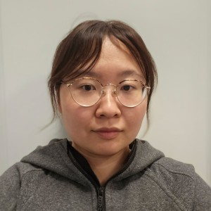 Headshot of a woman wearing glasses.