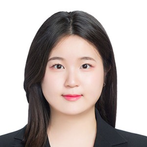 Headshot of a young woman with dark hair.