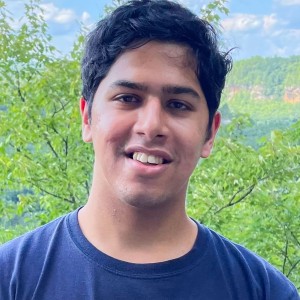 Headshot of a young man with dark hair.