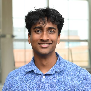 Headshot of a young man with short hair.