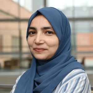 Headshot of a woman wearing a head scarf.