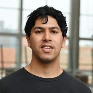 Headshot of a young man with dark hair.
