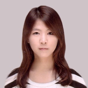 Headshot of a young woman with long, dark hair.