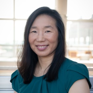 Headshot of a woman in business attire.