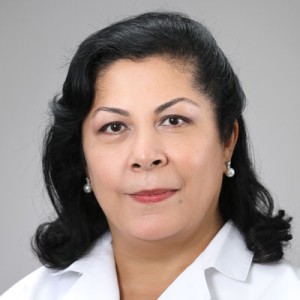 A woman with long dark hair.