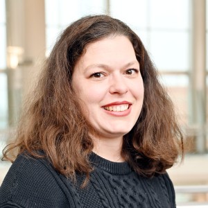 Headshot of a woman with long dark hair.