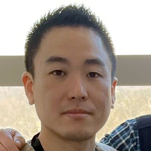 Headshot of a young man with short hair.