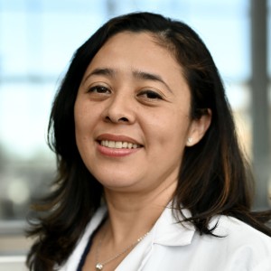 Headshot of a woman with long dark hair.