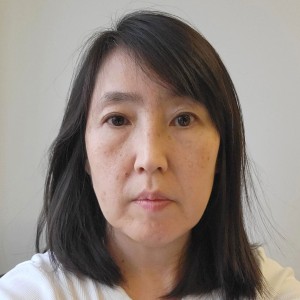 Headshot of a woman with long dark hair.