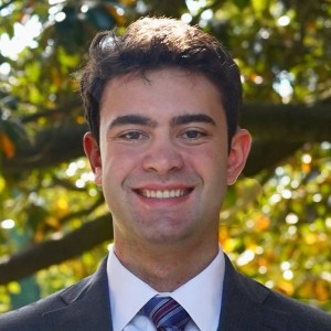 Headshot of a young man with short hair.