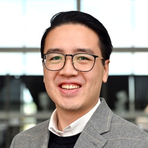 Headshot of a young man wearing glasses.