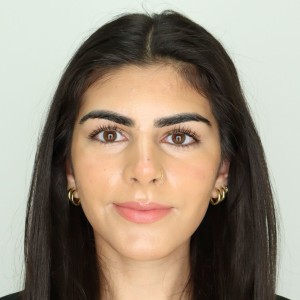 Headshot of a young woman with dark hair. 