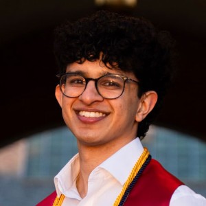 Headshot of a young man wearing glasses.