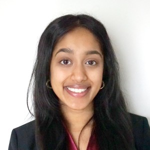 Headshot of a young woman with long, dark hair.