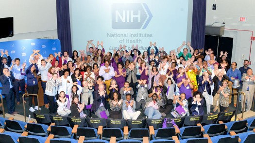 Group photo of many people in an auditorium