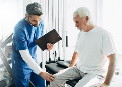 photo of doctor looking at patient's knee