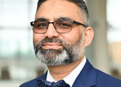 Headshot of a man in a jacket and bow tie.
