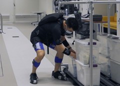 Photo of young man bending and employing the wearable device